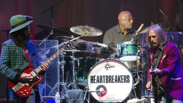 From left to right: Mike Campbell, Steve Ferrone and Tom Petty in action Sept. 11 at PNC Bank Arts Center in Holmdel, N.J. (Photo by Chris M. Junior)