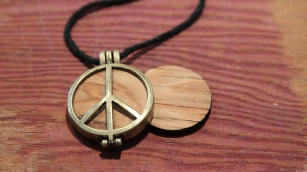  A piece of the Original Woodstock stage fashioned into a necklace.