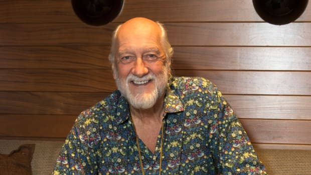  Mick Fleetwood posing with his latest book, "Love That Burns." Photo by Chris M. Junior