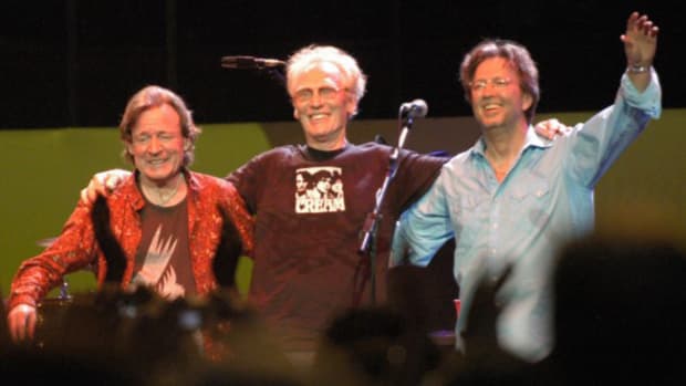  Ginger Baker, standing between Jack Bruce and Eric Clapton, during a Cream Reunion concert at Royal Albert Hall London, May 2005. Jill Furmanovsky/Star File/Courtesy of Rhino Records.