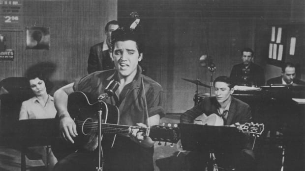 ELVIS PRESLEY performs in a recording session for his movie, “Jailhouse Rock.” Photo courtesy MGM/1957 Loew’s Inc.