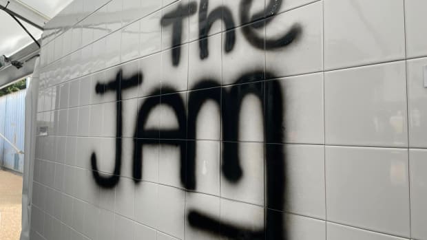 The spray-painted Jam wall patterned after the one used on the cover of The Jam’s 1977 debut album In The City. Many fans at the exhibition posed for photos by the wall. (Photo by John Curley)