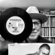 In photo: YouTube content creator and dedicated music collector - Norman "Mazzy" Maslov - from his music library in Seattle, WA, with a promotional mono copy of Dylan's "Hurricane" including original picture sleeve
