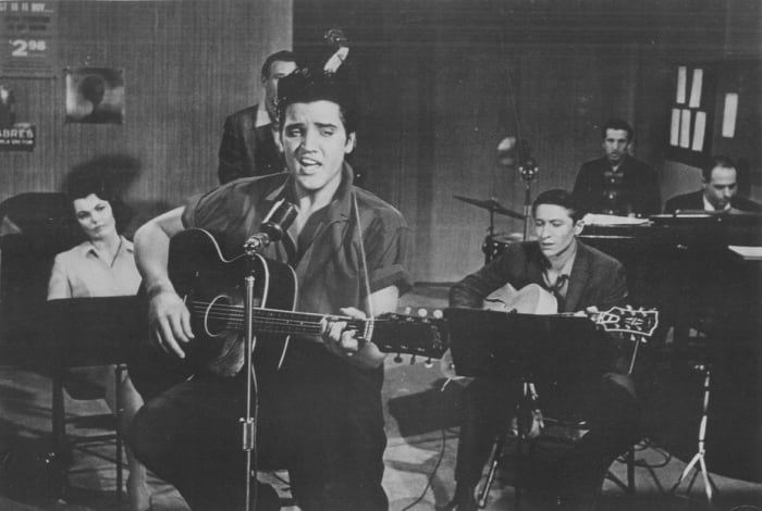 ELVIS PRESLEY performs in a recording session for his movie, “Jailhouse Rock.” Photo courtesy MGM/1957 Loew’s Inc.