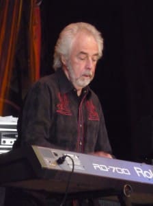 These days, you can find Colin Earl with the King Earl Boogie Band, maybe even playing “Plastic Jesus.”