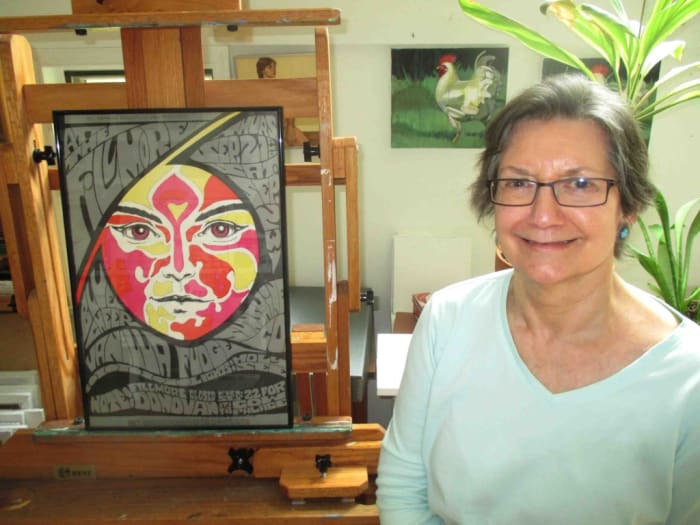 Original Fillmore Auditorium poster artist Bonnie MacLean, shown here in her suburban Philadelphia home studio with a first-run poster she created in the ‘60s for a concert with Vanilla Fudge and Blue Cheer, has been commissioned by Live Nation to create an exclusive souvenir poster featuring Hall & Oates to commemorate their Opening Night performance Oct. 1. Photo credit: Randex Communications.