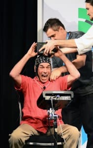 Mickey Hart rejoices after finishing a demonstration of NeuroDrummer during the "Rhythm and the Brain" panel. (Photo by Chris M. Junior)