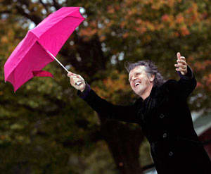 THE SUNSHINE SUPERMAN sings in the rain in a field in Woodstock, N.Y., in October 2008. (AP Photo/Mike Groll).