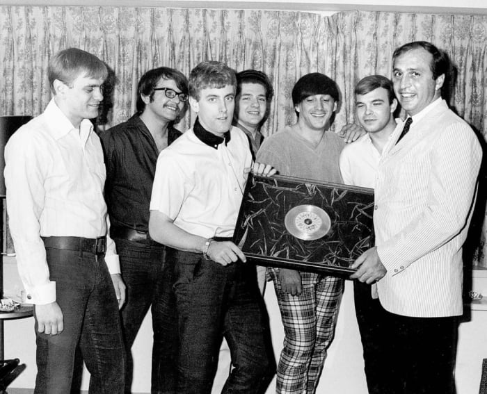 ROULETTE RECORDS PRESIDENT Morris Levy presents Tommy James and The Shondells with the group’s first gold record award in 1966 for “Hanky Panky.” Photo courtesy of Tommy James/Scribner