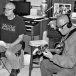 Severo Jornacion overdubs a bass line during a Dec. 13 recording session for the upcoming Smithereens album, which is being produced by Don Dixon (left). (Photo by Chris M. Junior)