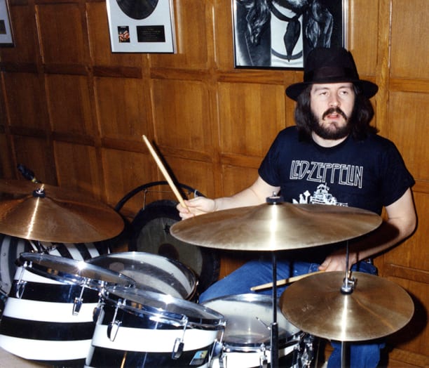 John Bonham drumming and wearing hat