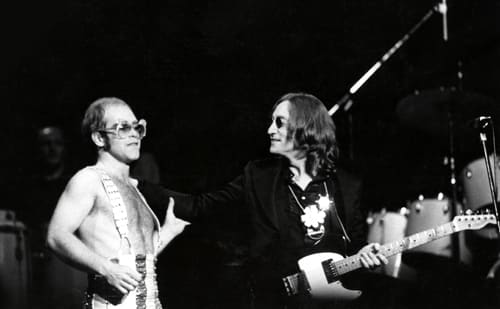 JOHN LENNON joins Elton John onstage at Madison Square Garden, New York City, Nov. 28, 1974. Photo by Steve Morley/Redferns/Getty Images