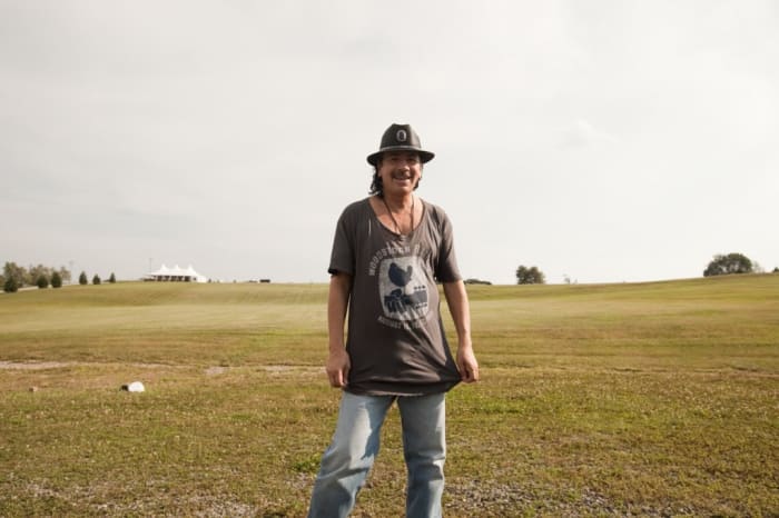 Before his sold out show Carlos Santana stands at the site of the 1969 Woodstock festival at Bethel Woods Center for the Arts. "This is ground zero for peace and love," he said proudly. Photos courtesy of Michael Bloom for Bethel Woods.