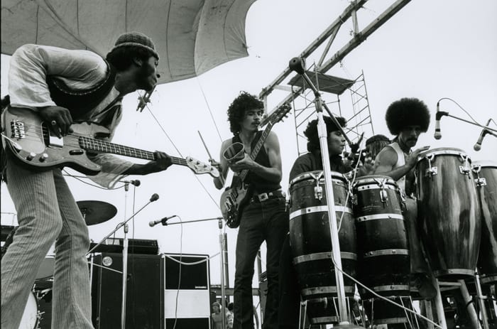 Santana performing at Woodstock in August 1969. Photo by Jason Laure, courtesy of Frank White Photo Agency.