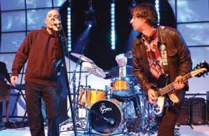R.E.M. appearS on the television show “Top of the Pops” at BBC TV Studios in London, Wednesday, Oct. 15, 2003. (AP Photo/Mark Allan)