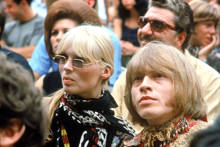 German model and singer Nico of the Velvet Underground and Brian Jones of The Rolling Stones sit in the audience at the Monterey International Pop Festival, Monterey California, 1967. Photo by Fotos International/Getty Images