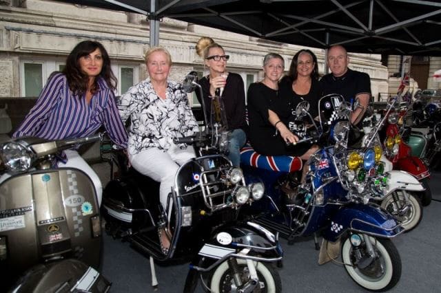 Den Davis, co-curator of The Jam’s About The Young Idea exhibition in Liverpool who has done a Q&A with GOLDMINE regarding the exhibition, is shown at far right in this photo taken outside the exhibition along with co-curator Nicky Weller (third from right) and Ann Weller (second from left), who is the mother of Paul and Nicky Weller. (Photo by Dean Fardell for Nicetime Productions)