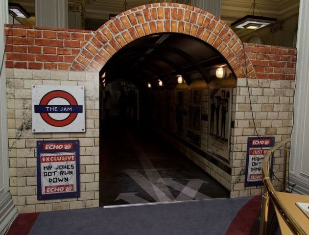 The tunnel that leads to the start of the exhibition is patterned after a passenger tunnel from the London Underground and is filled with Jam posters. (Photo by Dean Fardell for Nicetime Productions)