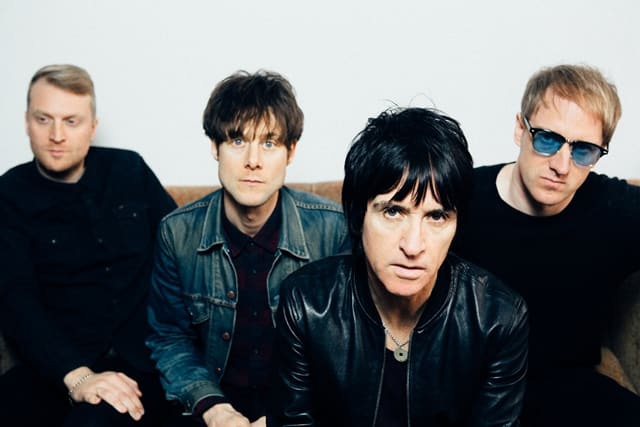 Legendary guitarist Johnny Marr (pictured second from right) and his band (left to right), drummer Jack Mitchell, bassist Iwan Gronow, and guitarist/keyboardist James Doviak, brought Marr’s Call The Comet tour to NYC’s Irving Plaza on Monday, October 15th. (Photo by Niall Lea)