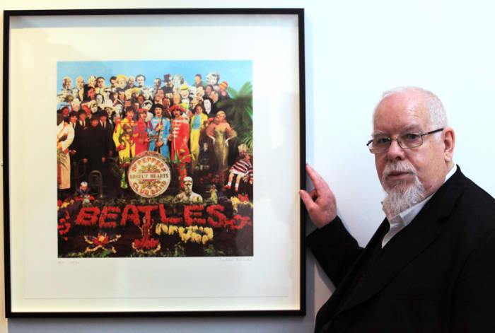 Artist Peter Blake poses besides a copy of The Beatles’ “Sgt. Pepper” album cover that he designed in 1967, as he reopened the Holburne Museum on May 12, 2011 in Bath, England. The museum’s first exhibition, “Peter Blake: A Museum for Myself,” had displayed objects from Blake’s own collection together with a number of important works by the artist himself. (Photo by Matt Cardy/Getty Images)