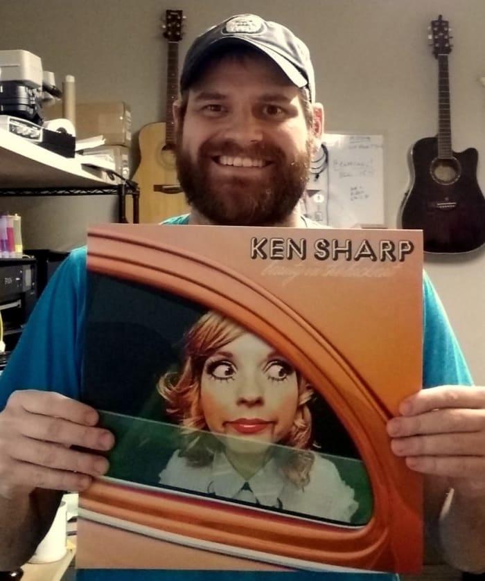 Rob Courtney, owner of Little Elephant Lathe, with Ken Sharp's latest album, 'Beauty in the Backseat.'