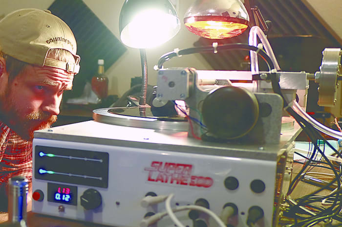 Brian Gross-Bias of Little Elephant Recording watches a vinyl record being cut Wednesday, November 16, 2016 in Toledo, Ohio.