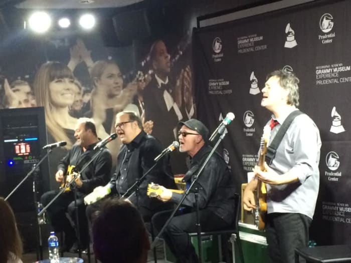 The Smithereens (left to right: Jim Babjak, Dennis Diken, guest vocalist Marshall Crenshaw and Mike Mesaros) participated in a night of talk and music at the Grammy Museum Experience at the Prudential Center in Newark, NJ on Thursday, October 24th. (Photo by John Curley)