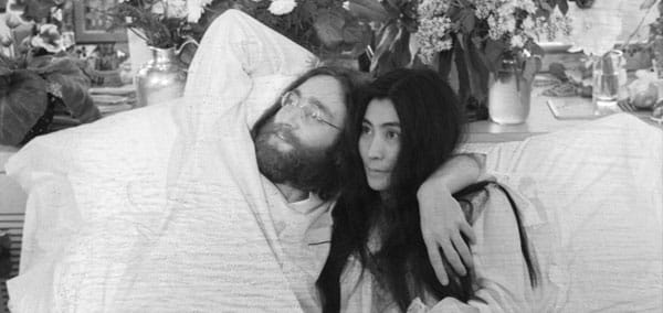 John Lennon and Yoko Ono, his bride of three months at the time this photo was taken in Montreal in June 1969, pose in bed. They held, in bed, press conferences in several cities with the theme, ‘make love, not war.’ Photo from the Bettmann Collection via Getty Images.