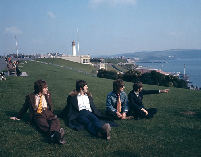 The Beatles (L-R): John Lennon, Paul McCartney, George Harrison and Ringo Starr pose for a group shot during their "Magical Mystery Tour." (Photo by David Redfern/Redferns)