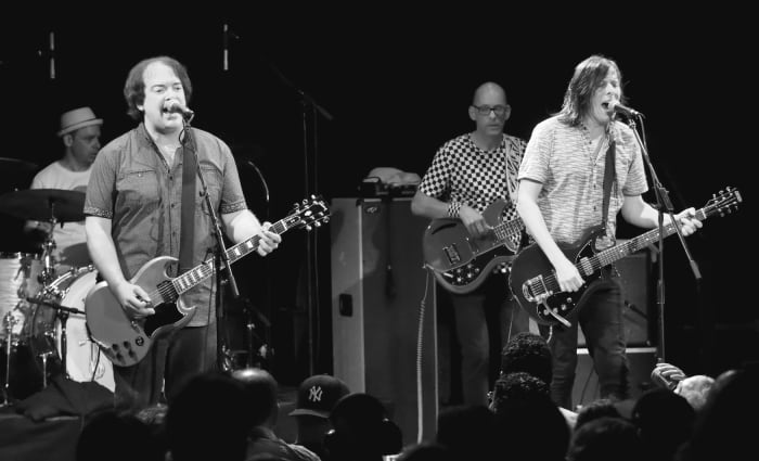Left to right: Mike Musburger, Jon Auer, Dave Fox and Ken Stringfellow of The Posies in action June 17 in New York. (Photo by Chris M. Junior)
