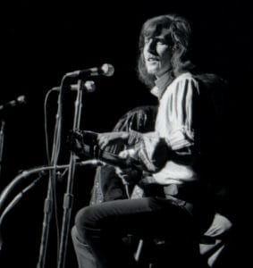 Graham Nash performing with CSNY in 1970 at the Fillmore East in New York City. (Photo by Jason Laure/Frank White Photo Agency)