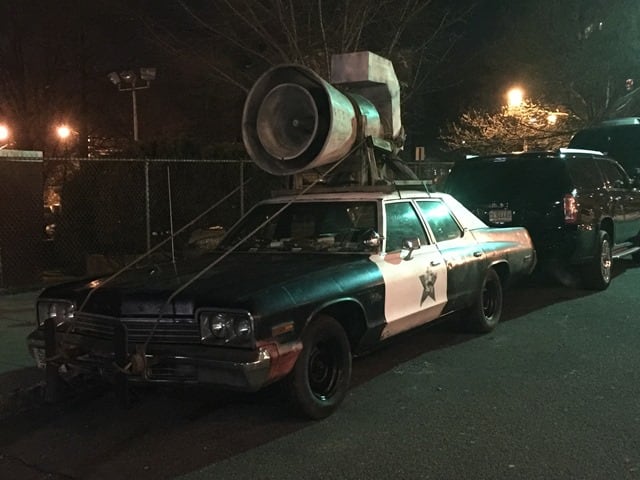 Fans arriving for The Blues Brothers’ show in Montclair were greeted by the magnificent sight of the Bluesmobile from the 1980 film The Blues Brothers, which was parked on the street opposite the theater, and many fans had their photos taken with it before heading inside for the show. (Photo by Mike Lamparello)