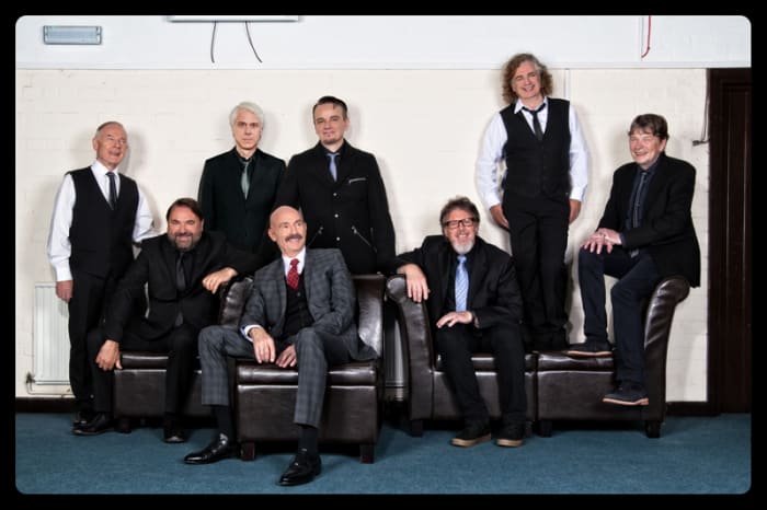 KING CRIMSON 2018 (L-R): Robert Fripp, Jeremy Stacey (sitting), Bill Rieflin, Tony Levin (sitting), Gavin Harrison, Pat Mastelotto (sitting), Jakko Jakszyk and Mel Collins.Photo by Dean Stocking.