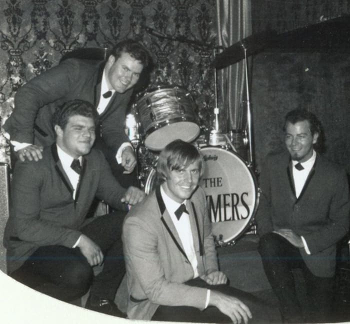 The Brymers (L-R): Kenny Sinner on vocals/keyboards/sax, Jim Mellick on vocals/guitar/harp (standing), Dick Lee on vocals/percussion and Bill Brumley on vocals/bass. Photo courtesy of Dick Lee.