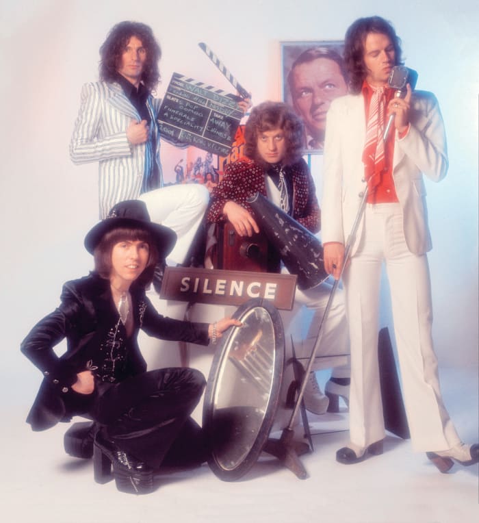 Slade, group portrait, London, 1975, (clockwise from bottom left) Dave Hill, Don Powell, Noddy Holder and Jim Lea. Michael Putland/Getty Images