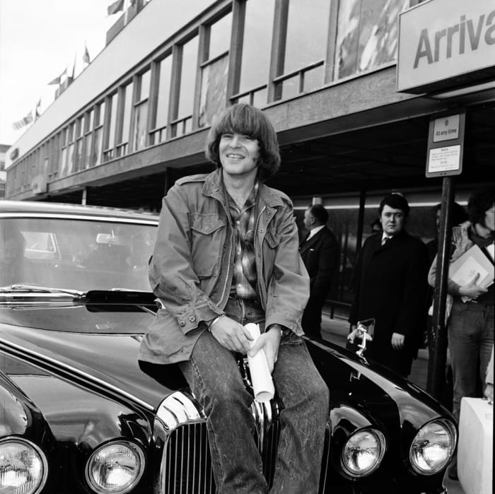 John Fogerty at Heathrow Airport, London, England, on April 7, 1970. Photo by Michael Putland/Getty Images.