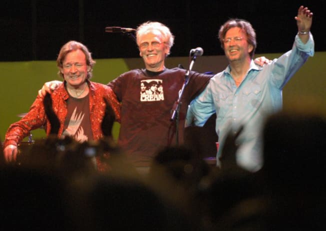 Ginger Baker, standing between Jack Bruce and Eric Clapton, during a Cream Reunion concert at Royal Albert Hall London, May 2005. Jill Furmanovsky/Star File/Courtesy of Rhino Records.