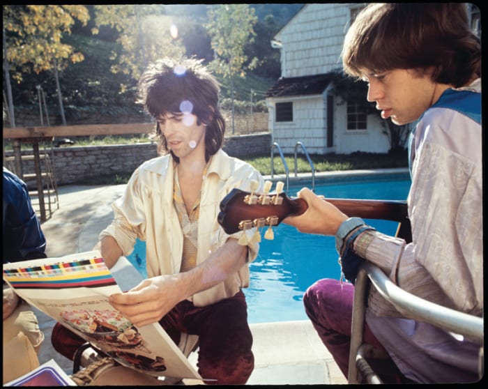 Keith Richards and Mick Jagger inspect "Let It Be" album cover press proof, Laurel Canyon, November 1969. Photo courtesy of ABKCO, © Ethan Russell.