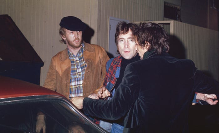 Harry Nilsson with John Lennon, getting thrown out of the Troubadour club in West Hollywood, California, for heckling, during Lennon’s much publicized ‘lost weekend.’ Photo by Maureen Donaldson/Getty Images.