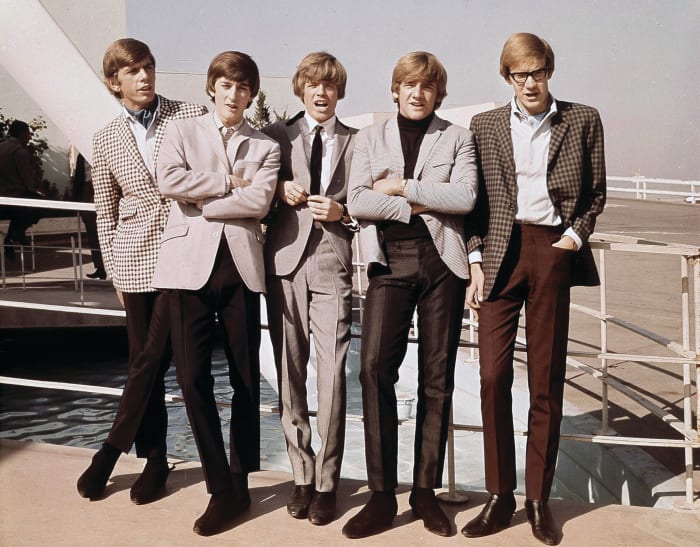 Herman’s Hermits (L-R): Barry Whitwam, Keith Hopwood, Peter Noone, Karl Green and Derek Leckenby ham it up for the 1960s U.S. media.