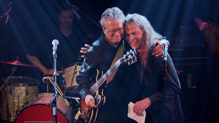 Richie Furay and Timothy B. Schmit onstage together during the Troubadour’s Deliverin’ performance. Publicity photo.
