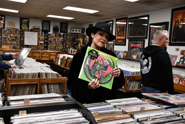 Vocalist Suzi Moon goes record shopping at Hoarders Trading Post in St. Charles, IL.