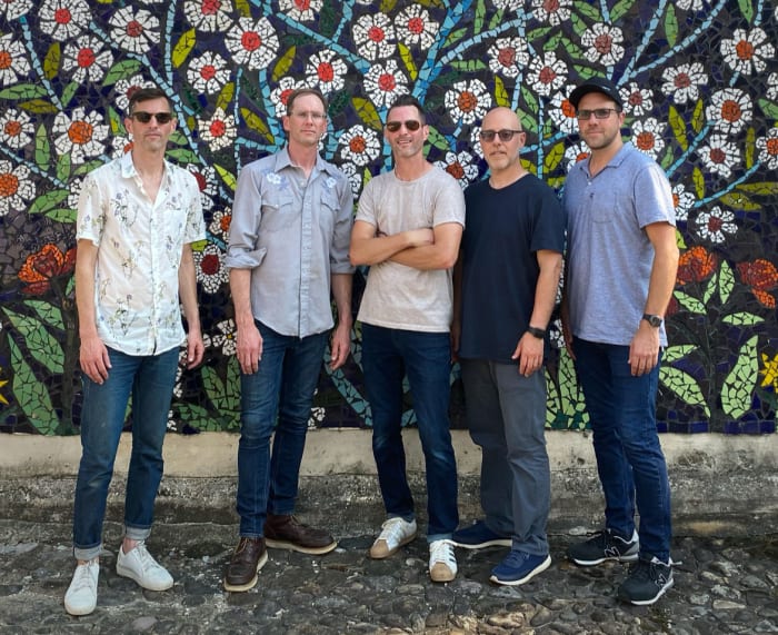 Lotus: (L-R) Jesse Miller, Chuck Morris, Luke Miller, Mike Greenfield, Tim Palmieri. Lotus Press Photo Floral Wall Ben Wong