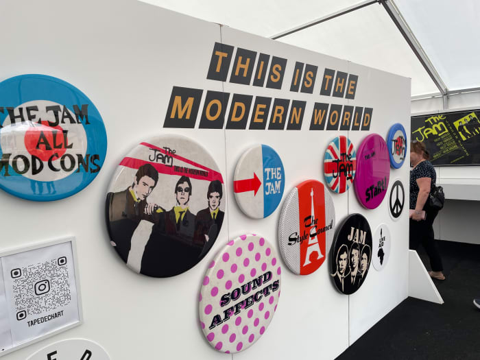 The wall of Jam and Style Council badges near the entrance to the exhibition. (Photo by John Curley)