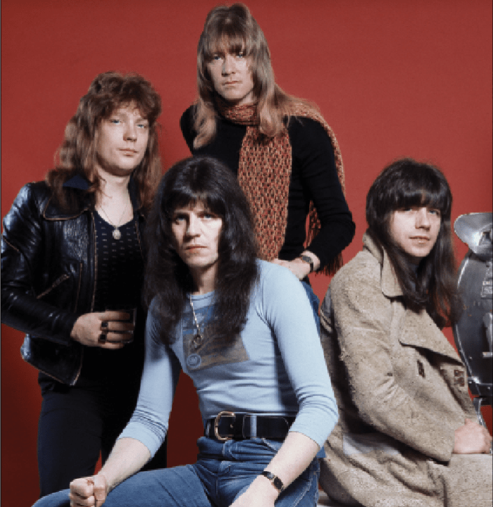 The classic Sweet lineup in London on January 13, 1976 (L-R): bassist Steve Priest (1948-2020), drummer Mick Tucker (1947-2002), singer Brian Connolly (1945-1997) and guitarist Andy Scott. Photo by Michael Putland/Getty Images