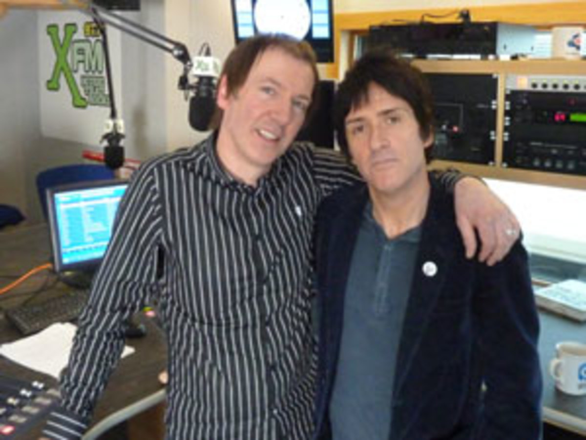 Mancunian guitar legend Johnny Marr (pictured at right above) was recently interviewed by DJ Clint Boon (at left above). The interview was part of the celebrations of XFM Manchester’s fifth anniversary.