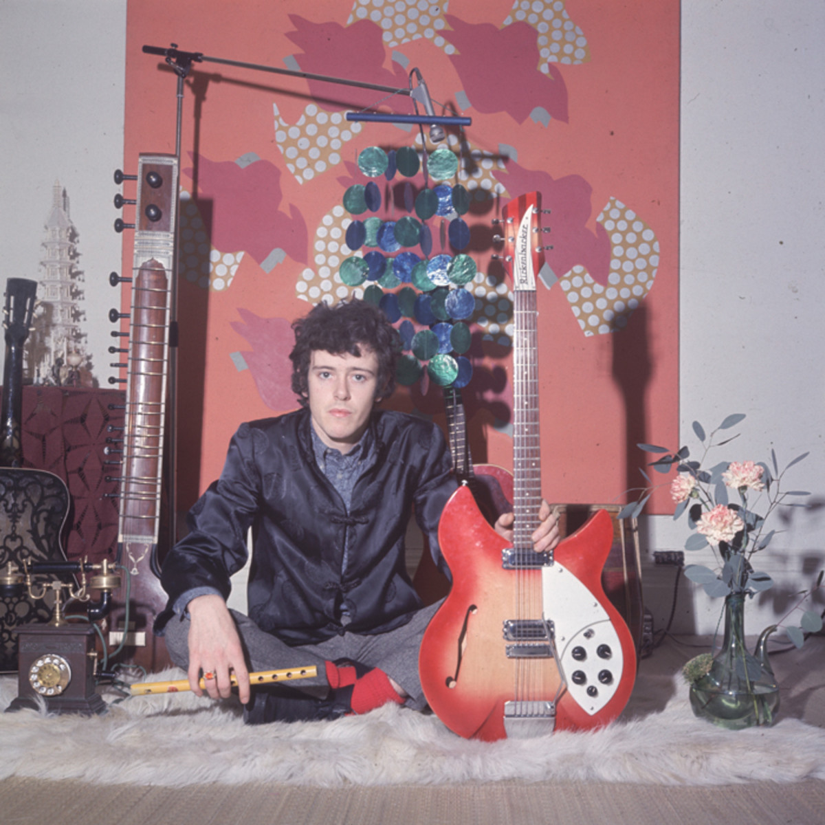  Donovan (Donovan Leitch) during the 1960s holding his Rickenbacker guitar and a flute, a sitar and other guitars in the background. (Photo by Keystone/Getty Images)