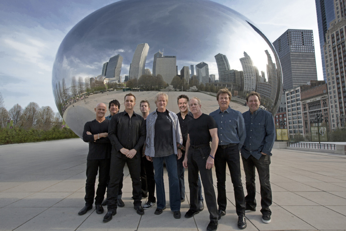 The current lineup of Chicago (L to R): Tris Imboden, Wally Reyes, Jr., Jason Scheff, Keith Howland, Lee Loughnane, Walt Parazaider, Jimmy Pankow, Robert Lamm and Lou Pardini. Publicity photo.