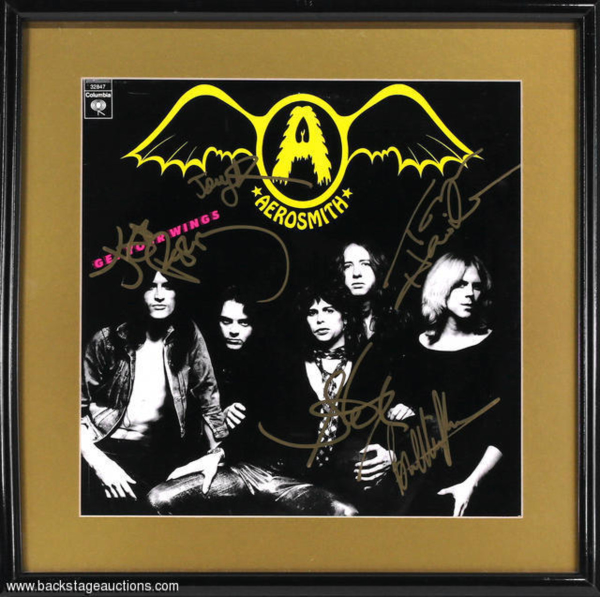  A fully band signed Aerosmith 'Get Your Wings' LP cover from 1974, featuring the autographs of Steven Tyler, Joe Perry, Tom Hamilton, Joey Kramer and Brad Whitford. All signatures are nicely done with a gold marker. The album cover is matted and housed in a 16 1/2 x 16 1/2 inch frame. Excellent condition. From the the private collection of David Frangioni.