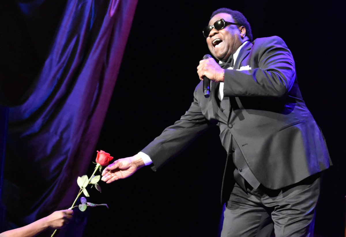  Al Green passes a rose to a female fan early in his May 5 show at Radio City Music Hall in New York. (Photo by Chris M. Junior)